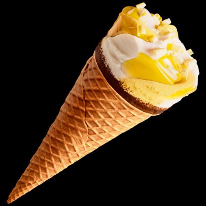 Bild von Cornetto Bottermelk Zitrone mit der Beschreibung Buttermilch-Eis mit Zitrone, Zitronensauce, dekoriert mit weißen Schokoladenstückchen.