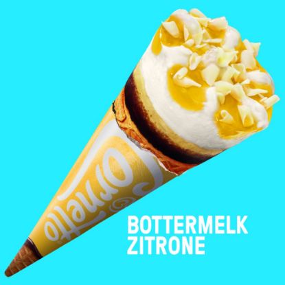 Bild von Cornetto Bottermelk Zitrone mit der Beschreibung Buttermilch-Eis mit Zitrone, Zitronensauce, dekoriert mit weißen Schokoladenstückchen.