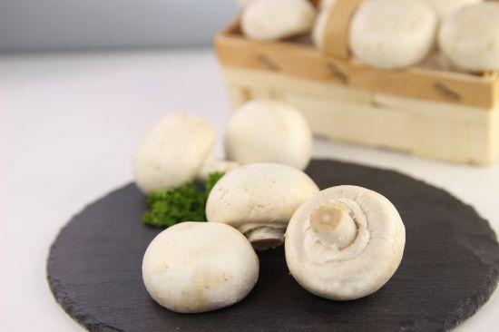 Bild von Champignons klein mit der Beschreibung ganze Köpfe, gefroren